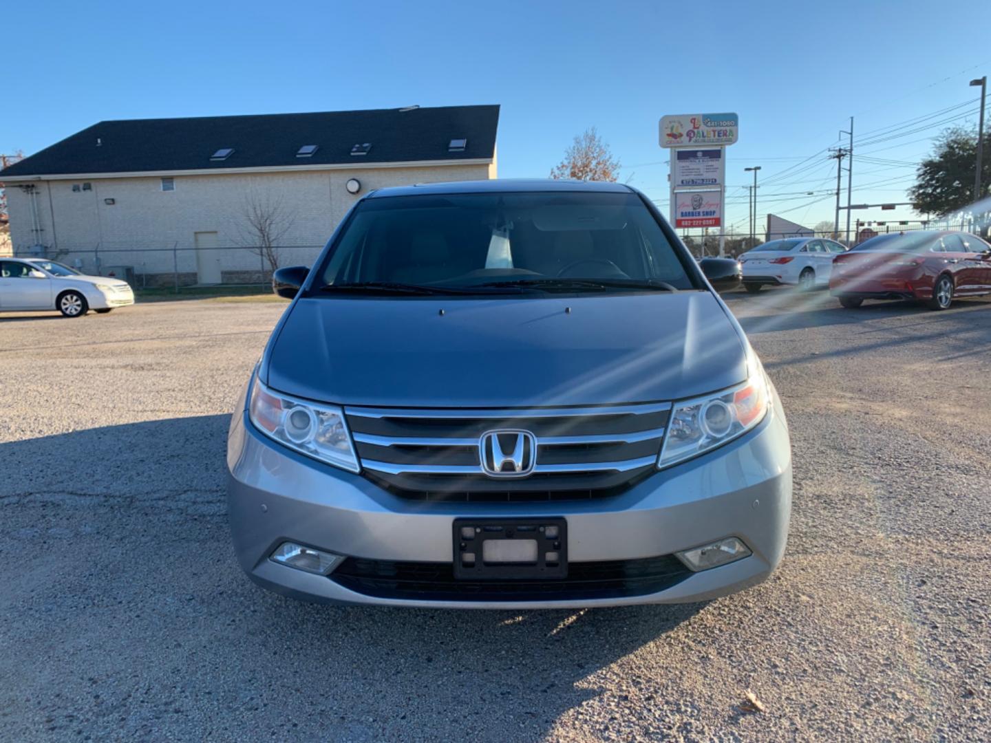 2012 Blue /gray Honda Odyssey Touring (5FNRL5H94CB) with an 3.7L L5 DOHC 20V engine, AUTOMATIC transmission, located at 1830 North Belt Line Road, Irving, TX, 75061, (469) 524-0199, 32.834373, -96.993584 - Photo#1